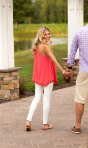 pink pompom top from revolve and white jeans