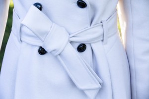 white peacoat with pleaded back