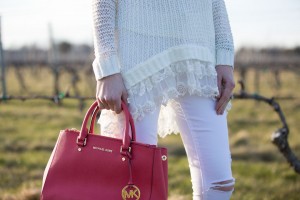 white ruffle sweater and white ripped jeans